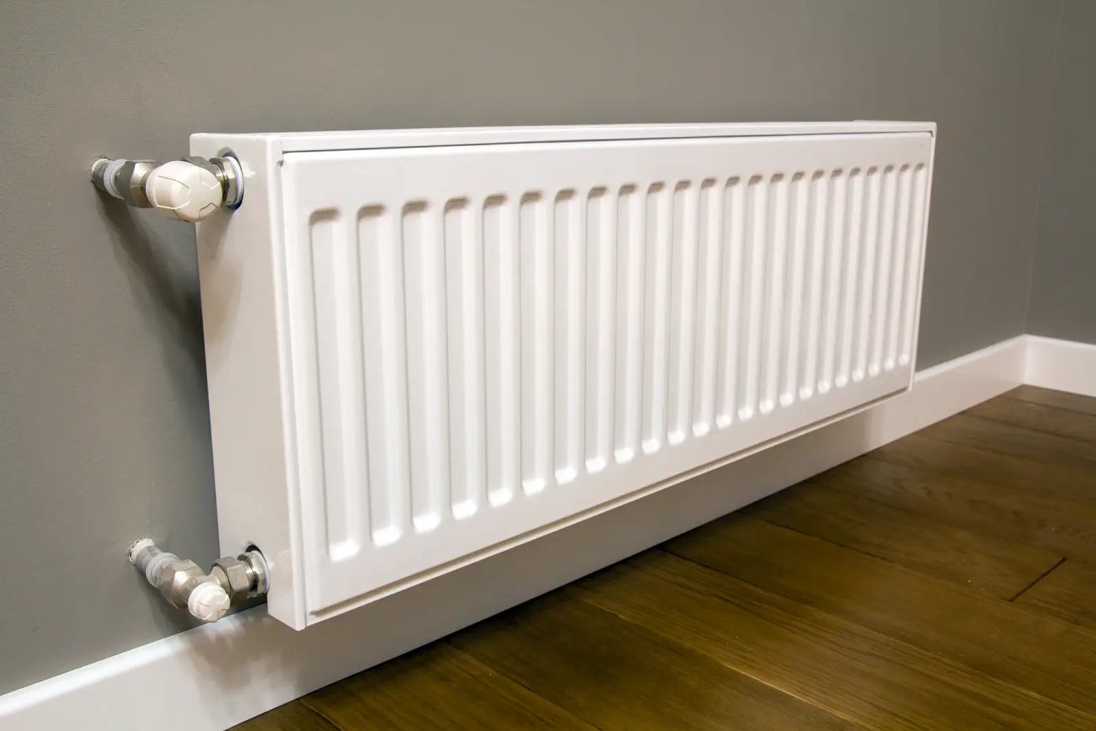 Modern radiator with a thermostatic valve in Epsom